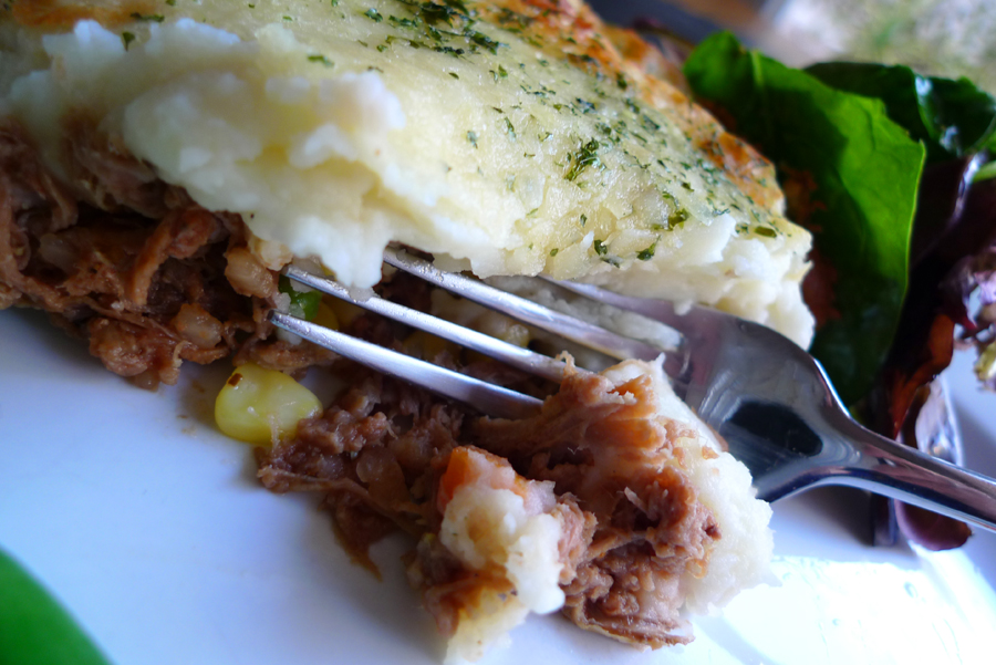Shepherd's Pie being sliced with a fork.