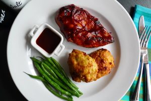 Kansas City BBQ Chicken Breast with Cornbread Bites and Kansas City style BBQ sauce, shown with green beans.