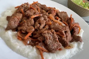 Braised Beef Tips over Polenta.
