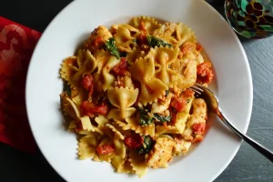 Feta, Chicken and Spinach Farfalle served in a bowl.