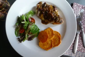 Marsala Jack Pork Chops shown plated with vegetable sides.