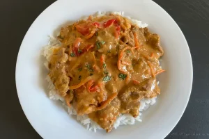 Panang Beef over Rice served in a bowl.