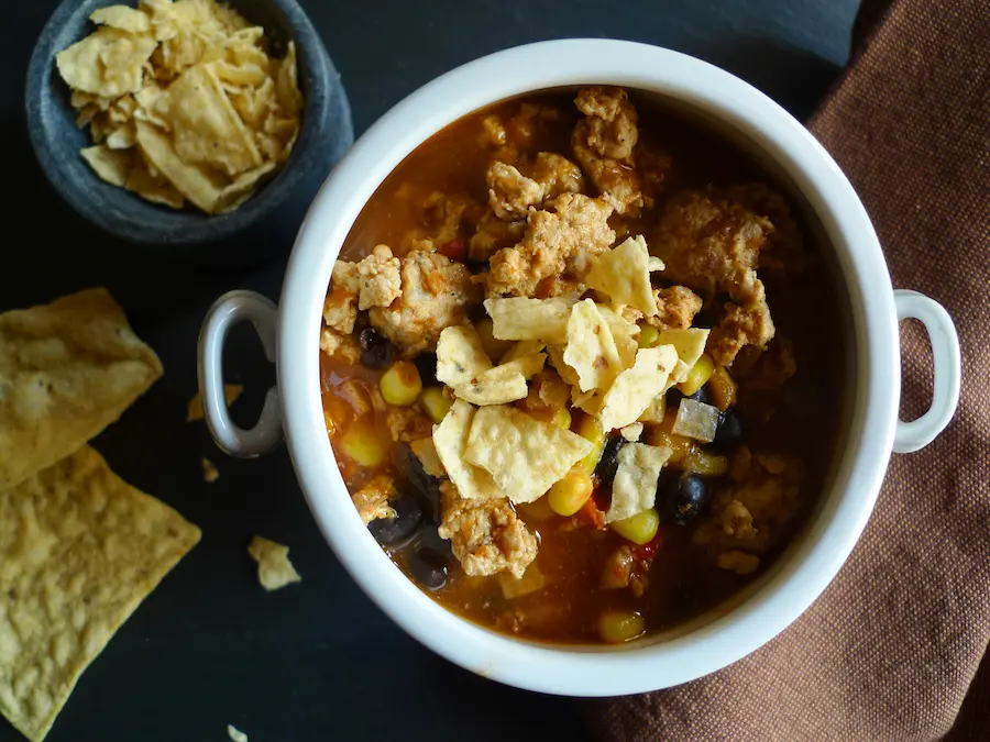 Southwestern Turkey Chili shown with tortilla chips on the side.