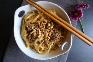 Szechuan Style Noodles with chopsticks.